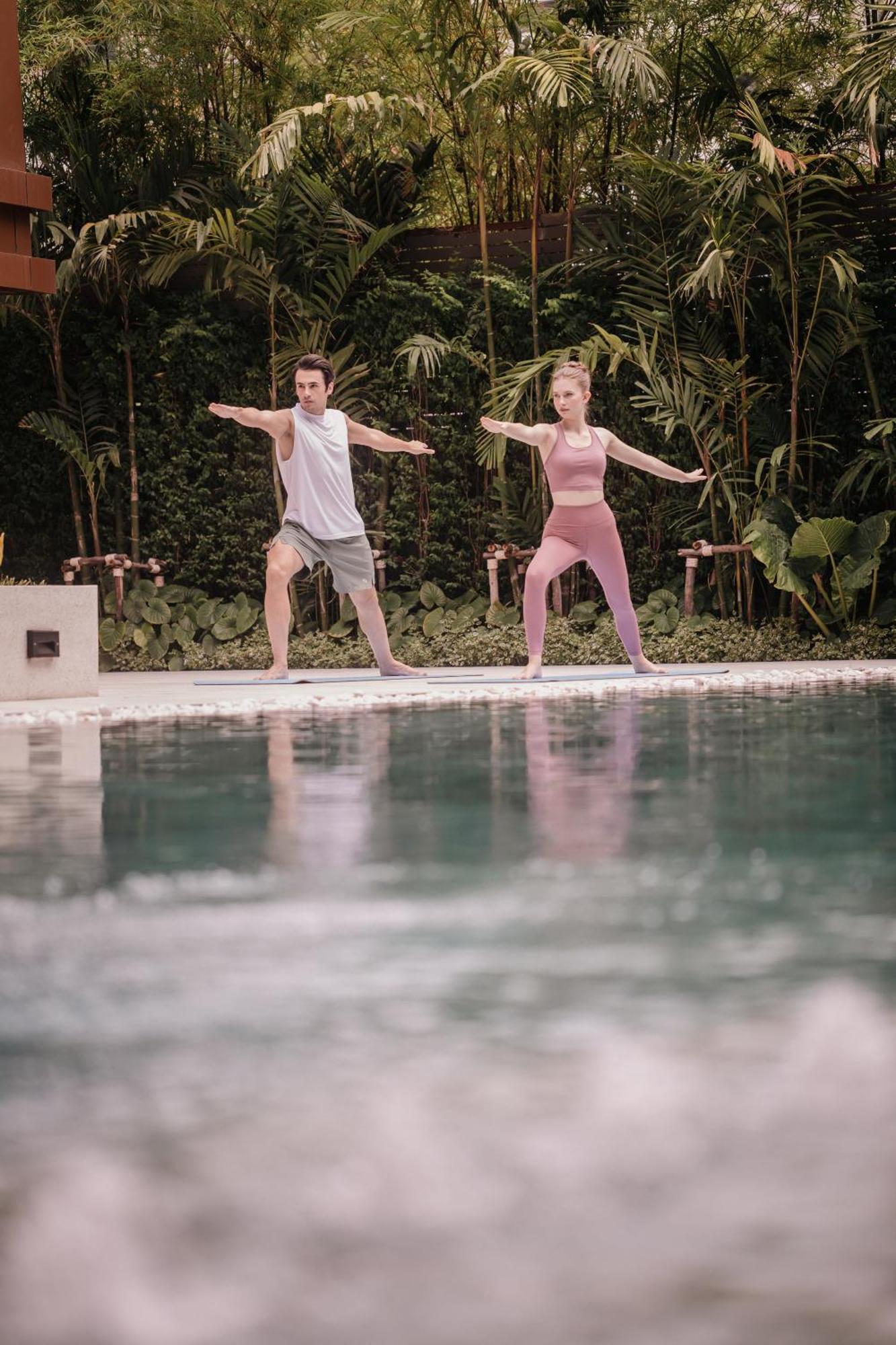 Nysa Hotel Bangkok Sukhumvit 11 ภายนอก รูปภาพ A couple practicing yoga